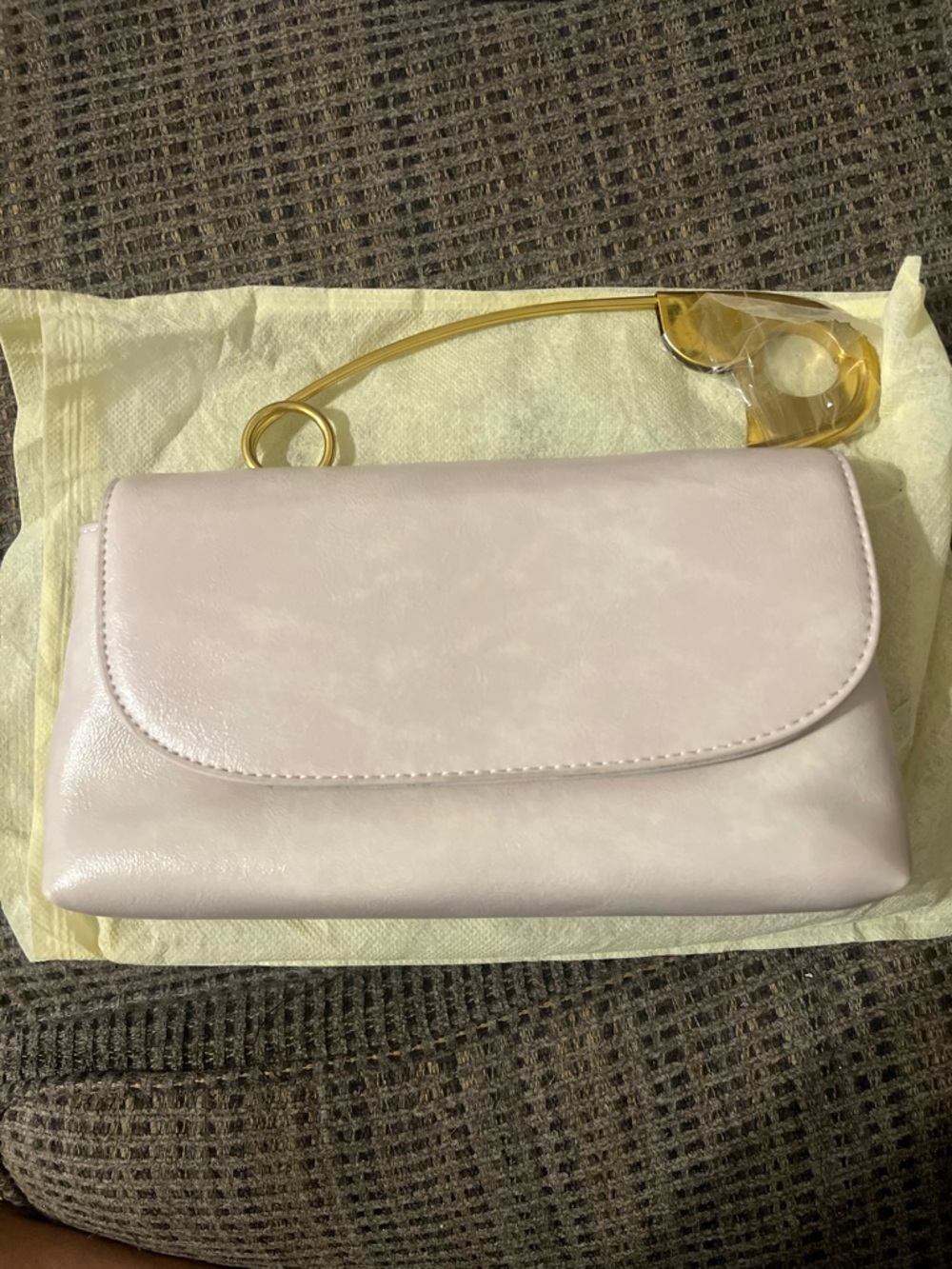 Elegant off white/creamWomen's Clutch with Gold Safety Pin Handle. Never used